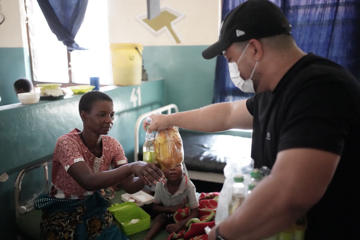 Team member giving supplies at the hospital